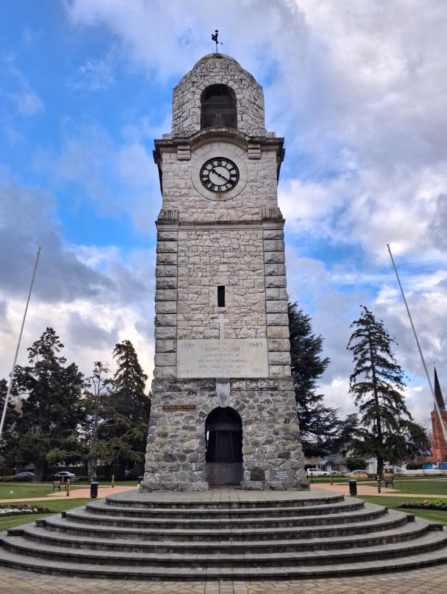 The concrete and marble Marlborough War Memorial clock tower standing in the centre of Seymour Square, Blenheim