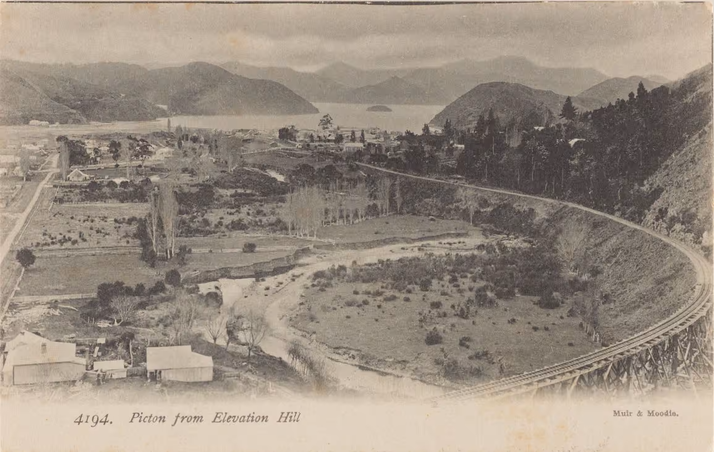 Postcard showing Picton and rail tracks viewed from Elevation Hill.